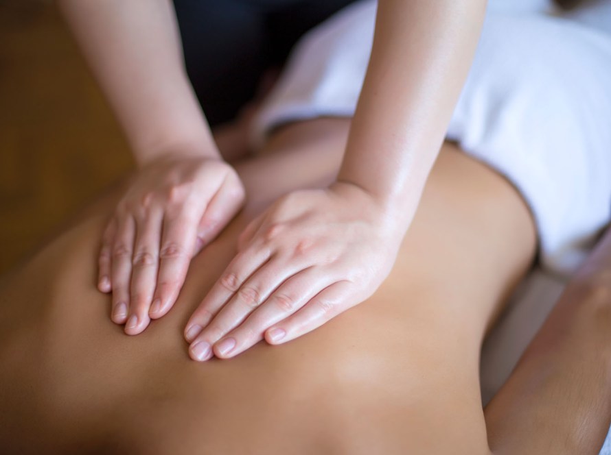 Client enjoying a relaxing Swedish massage at our Pacific Beach wellness center in San Diego